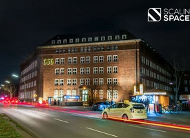 Furnished office spaces including meeting rooms and community areas
